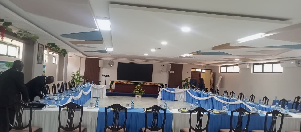 Delegates’ tables being prepared in the conference hall.