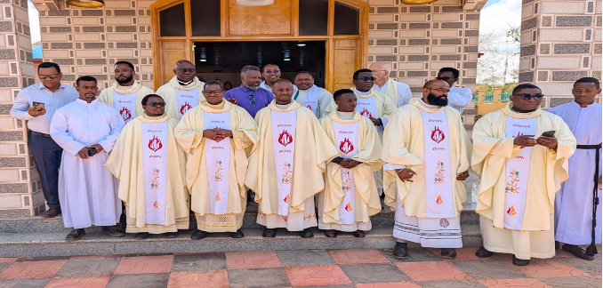 A group of Spiritans and some Christians pose for a photo after Holy Mass