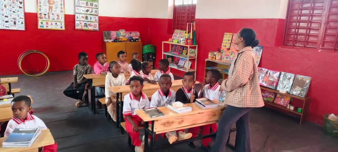 A teacher with her pupils in a new classroom at Spiritan Primary School Yabello